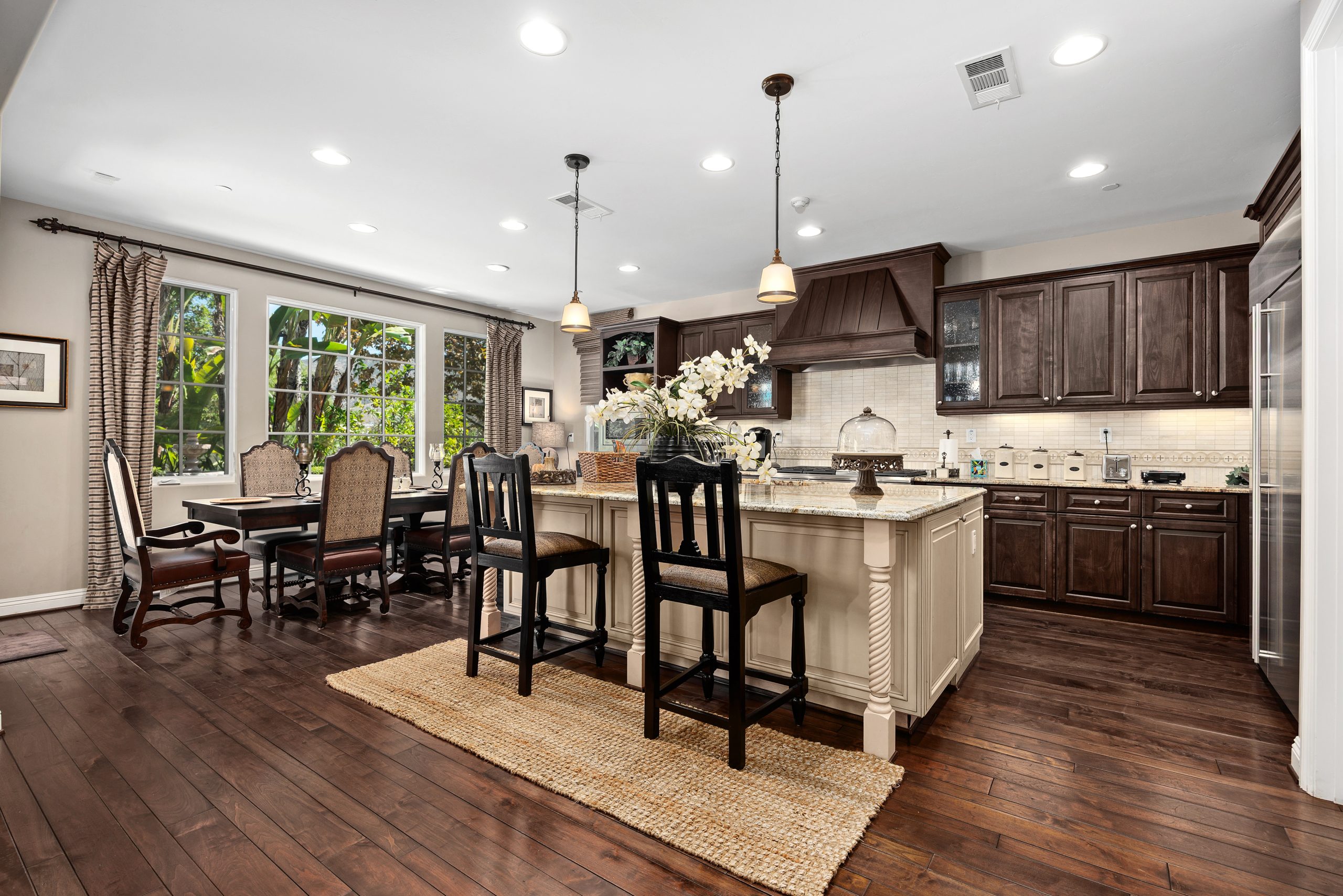 Elegant family room with fireplace and views in Rancho Santa Fe luxury home